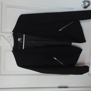 Black cropped blazer.